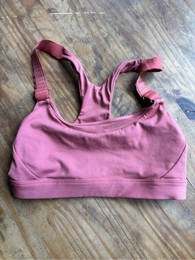 Pink Athleta bra with cool adjustable straps in the front